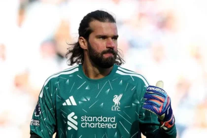 Liverpool Define Futuro No Gol: Alisson Permanece Até 2027 Enquanto Sucessão Com Mamardashvili E Promessa Brughmans Agita Bastidores De Anfield